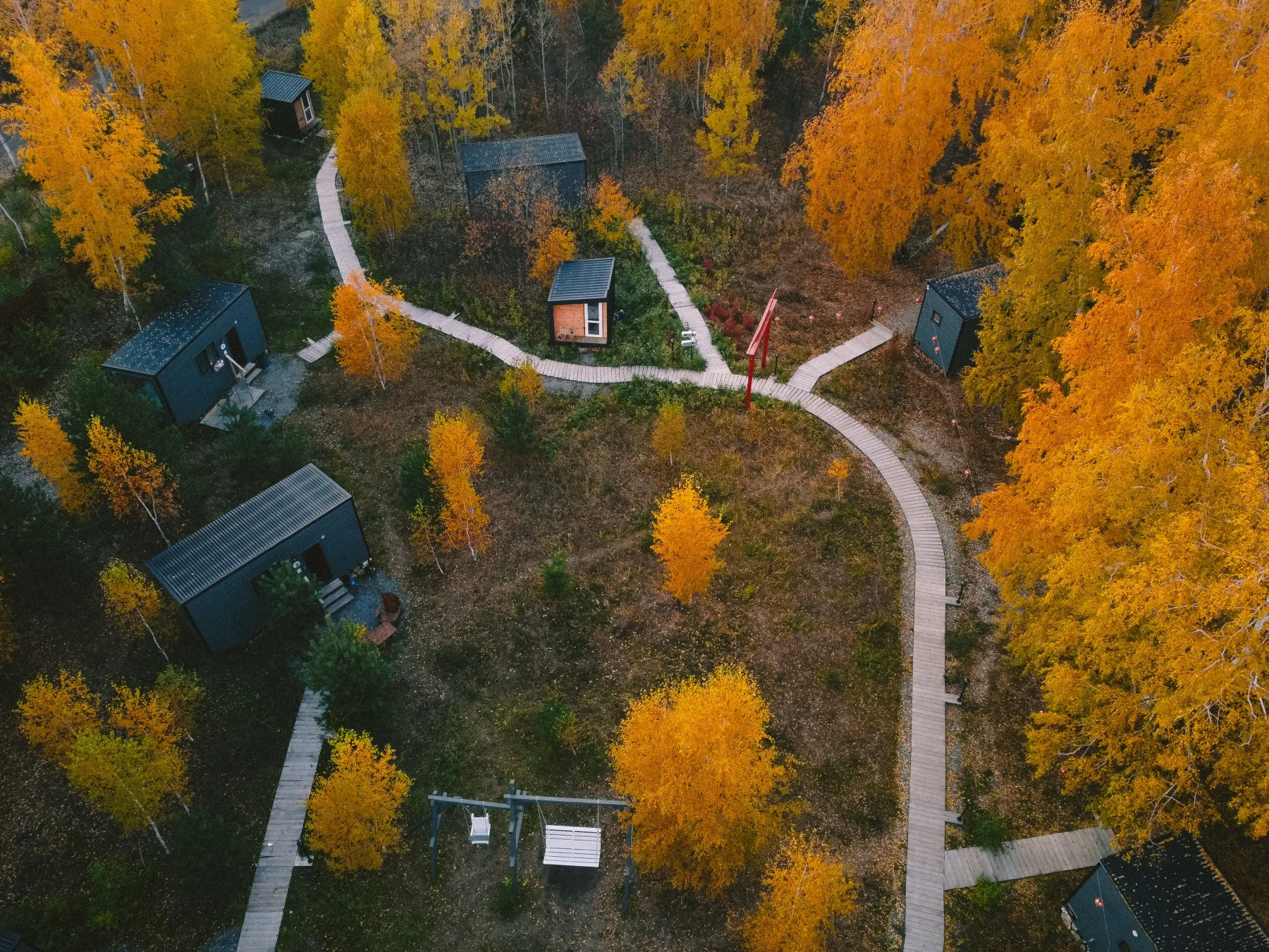 Aerial view of a small-home community connected by walking paths