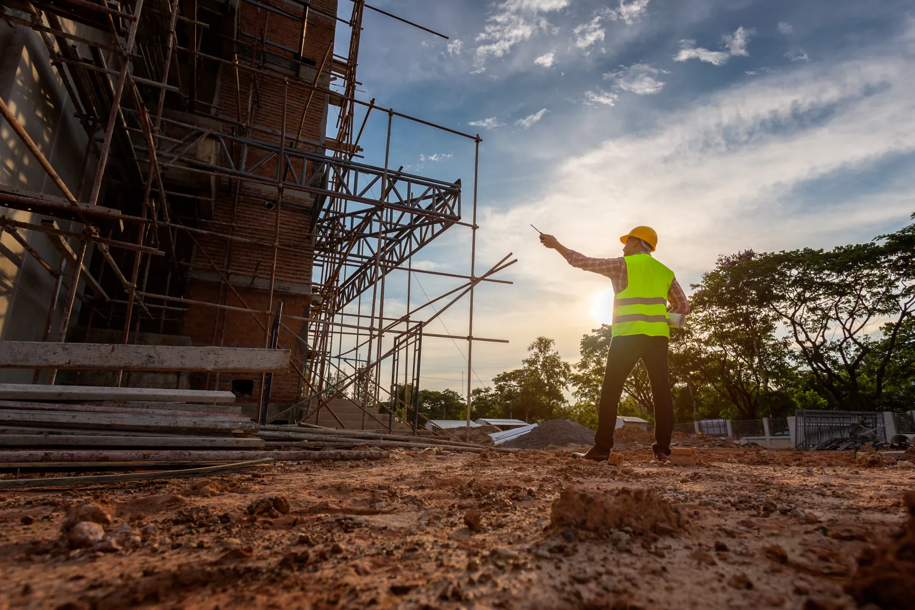A construction professional considering possibilities at a development site